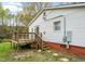 Home exterior with a wooden deck, stairs, and vinyl siding at 2721 Thelma St, Durham, NC 27704