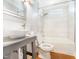 Bright bathroom with tiled shower/tub, a vessel sink, and stylish fixtures at 2721 Thelma St, Durham, NC 27704