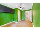 Cozy bedroom featuring hardwood floors, a ceiling fan, and closet for organized storage at 2721 Thelma St, Durham, NC 27704