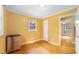 Bedroom with hardwood floors, mini fridge, closet and window with natural light at 2721 Thelma St, Durham, NC 27704
