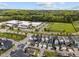 Enjoy this community aerial view with a school and sports field nearby and gorgeous tree lined backdrop at 282 Granite Mill Blvd, Chapel Hill, NC 27516