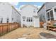 Backyard area, fenced in for privacy, that features a fire pit and grill at 282 Granite Mill Blvd, Chapel Hill, NC 27516