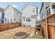 Shot of a cozy backyard with a grill and circular fire pit feature at 282 Granite Mill Blvd, Chapel Hill, NC 27516