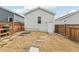 Backyard view with a grassy yard, stepping stones and a fire pit. The space is enclosed by a wood fence at 282 Granite Mill Blvd, Chapel Hill, NC 27516