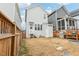 A fenced in backyard area with a grill and fire pit at 282 Granite Mill Blvd, Chapel Hill, NC 27516
