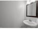 Sleek half-bathroom featuring a modern vanity, stylish mirror, and minimalist design, maximizing space at 282 Granite Mill Blvd, Chapel Hill, NC 27516