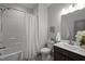 Modern bathroom featuring a shower-tub combination and a dark vanity at 282 Granite Mill Blvd, Chapel Hill, NC 27516