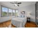 Cozy bedroom featuring hardwood floors, neutral colors, and natural light from windows at 282 Granite Mill Blvd, Chapel Hill, NC 27516