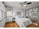 Bright bedroom with hardwood floors, natural light and mirrored closet doors at 282 Granite Mill Blvd, Chapel Hill, NC 27516