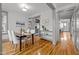 Bright dining room featuring hardwood floors, modern decor, and seamless transition to other living spaces at 282 Granite Mill Blvd, Chapel Hill, NC 27516