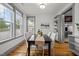 Elegant dining area with hardwood floors, large windows, and modern furnishings, creating a warm ambiance at 282 Granite Mill Blvd, Chapel Hill, NC 27516
