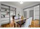 Stylish dining area with open shelving, hardwood floors, and seamless flow to adjacent rooms, ideal for entertaining at 282 Granite Mill Blvd, Chapel Hill, NC 27516