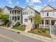 Picturesque neighborhood scene featuring well-maintained homes, each with charming front porches and manicured lawns at 282 Granite Mill Blvd, Chapel Hill, NC 27516