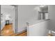Upstairs hallway offers access to bedrooms and bathrooms with neutral paint and trim at 282 Granite Mill Blvd, Chapel Hill, NC 27516