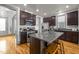 Stylish kitchen with stainless appliances, granite countertops and island with seating at 282 Granite Mill Blvd, Chapel Hill, NC 27516