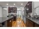 Lovely kitchen features granite countertops, stainless appliances, and dark wood cabinets at 282 Granite Mill Blvd, Chapel Hill, NC 27516