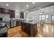 Modern kitchen with stainless steel appliances, granite countertops, and open layout connecting to the living area at 282 Granite Mill Blvd, Chapel Hill, NC 27516