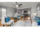 Cozy living room open to dining and kitchen area with hardwood floors and large windows at 282 Granite Mill Blvd, Chapel Hill, NC 27516