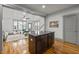 Open concept living room flows into kitchen with hardwood floors and neutral decor at 282 Granite Mill Blvd, Chapel Hill, NC 27516
