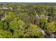 Aerial view of the property nestled in a serene, tree-filled landscape, showcasing its private and picturesque setting at 3014 Hope Valley Rd, Durham, NC 27707