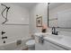 Stylish bathroom featuring a tub with white tile surround, toilet, and a modern vanity at 3014 Hope Valley Rd, Durham, NC 27707