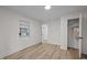 Bright bedroom with hardwood floors, closet, and built-in shelving for ample storage at 3014 Hope Valley Rd, Durham, NC 27707