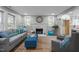 Cozy living room with a decorative fireplace, neutral walls, wood floors, and plush seating at 3014 Hope Valley Rd, Durham, NC 27707