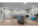 Bright living room featuring a stone fireplace, comfortable seating, wood floors, and natural light at 3014 Hope Valley Rd, Durham, NC 27707