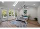 Main bedroom features high ceilings, skylights, access to deck, and natural light at 3014 Hope Valley Rd, Durham, NC 27707