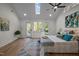 Main bedroom features high ceilings, skylights, access to deck, and natural light at 3014 Hope Valley Rd, Durham, NC 27707