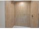 Walk-in shower with vertical tile and brushed-nickel shower head at 3014 Hope Valley Rd, Durham, NC 27707