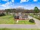 Expansive aerial view showcasing the property's well-maintained lawn and surrounding neighborhood at 305 E First St, Princeton, NC 27569