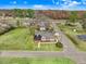 Aerial view of a charming house with well-manicured lawn and mature trees at 305 E First St, Princeton, NC 27569