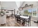 Open concept dining room featuring a modern chandelier and view of the kitchen at 305 E First St, Princeton, NC 27569