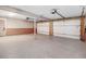 Spacious three car garage with clean epoxy floors and ample storage space at 305 E First St, Princeton, NC 27569