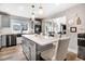 Spacious and bright kitchen with a large island, stainless steel appliances, and modern fixtures at 305 E First St, Princeton, NC 27569