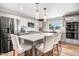A spacious kitchen featuring stainless steel appliances and a large island with bar seating at 305 E First St, Princeton, NC 27569