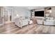 Inviting living room featuring cozy seating, built-in shelving, and abundant natural light at 305 E First St, Princeton, NC 27569