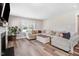 Cozy living room features a fireplace, hardwood floors, and ample natural light at 305 E First St, Princeton, NC 27569