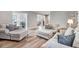 Comfortable living room with stylish seating arrangements and a seamless flow into other living spaces at 305 E First St, Princeton, NC 27569