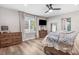 Comfortable bedroom featuring a plush bed, natural light, and two dressers for ample storage at 305 E First St, Princeton, NC 27569
