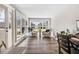 Bright sunroom with multiple windows, comfortable seating, and views of the outdoor landscape at 305 E First St, Princeton, NC 27569