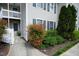 Inviting townhome exterior features tidy landscaping and a sidewalk leading to the front door at 3336 Tarleton W, Durham, NC 27713