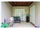 Covered patio area with bench seating, water cooler, and additional storage at 3336 Tarleton W, Durham, NC 27713