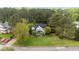 Aerial shot of a beautiful home with a well-manicured lawn and mature trees in a peaceful neighborhood setting at 402 Green Turret Dr, Rolesville, NC 27571
