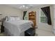 Serene bedroom with white bedding, natural light, and cozy decor at 402 Green Turret Dr, Rolesville, NC 27571