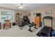 Spacious home gym complete with exercise equipment, natural light, and ample space at 402 Green Turret Dr, Rolesville, NC 27571