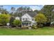 Charming two-story home featuring a well-manicured lawn and inviting front porch at 402 Green Turret Dr, Rolesville, NC 27571