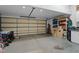 Spacious garage with an insulated door, storage shelves, and ample room for parking and projects at 402 Green Turret Dr, Rolesville, NC 27571