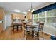 Eat-in kitchen with hardwood floors, a dining table, and lots of natural light at 402 Green Turret Dr, Rolesville, NC 27571